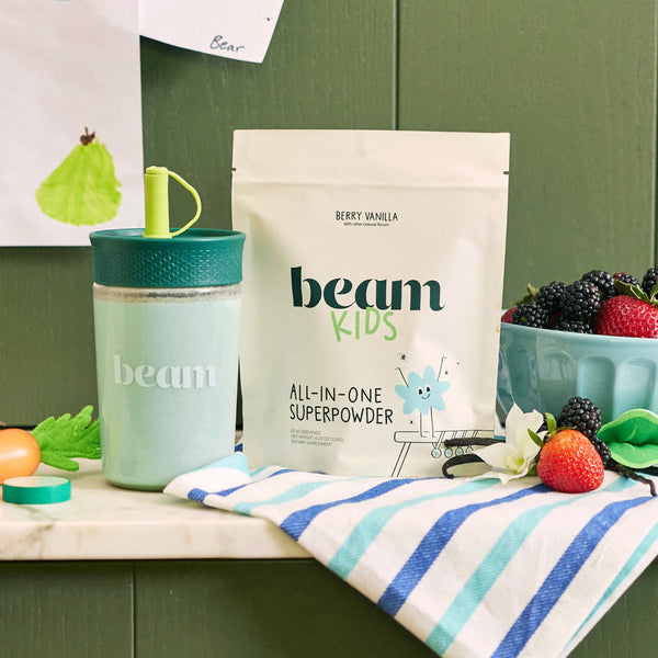 Beam Kids All-In-One Superpowder in Berry Vanilla flavor, displayed with fresh berries